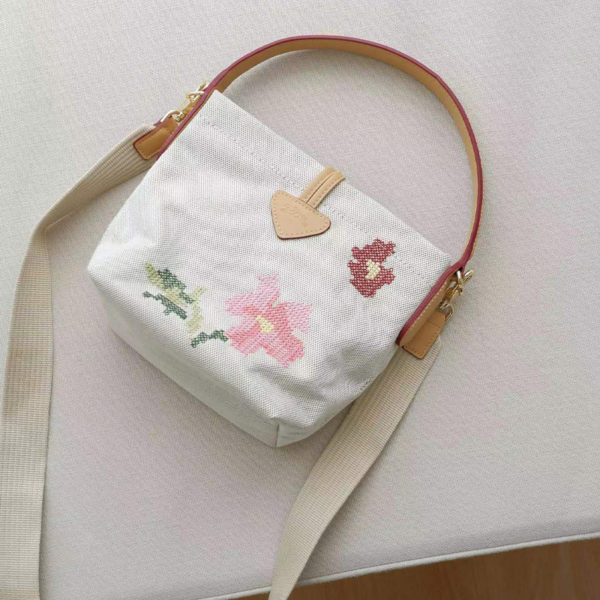 2022 spring and summer high-quality canvas rural style fashion personality ladies knitted bucket bag shoulder bag 1